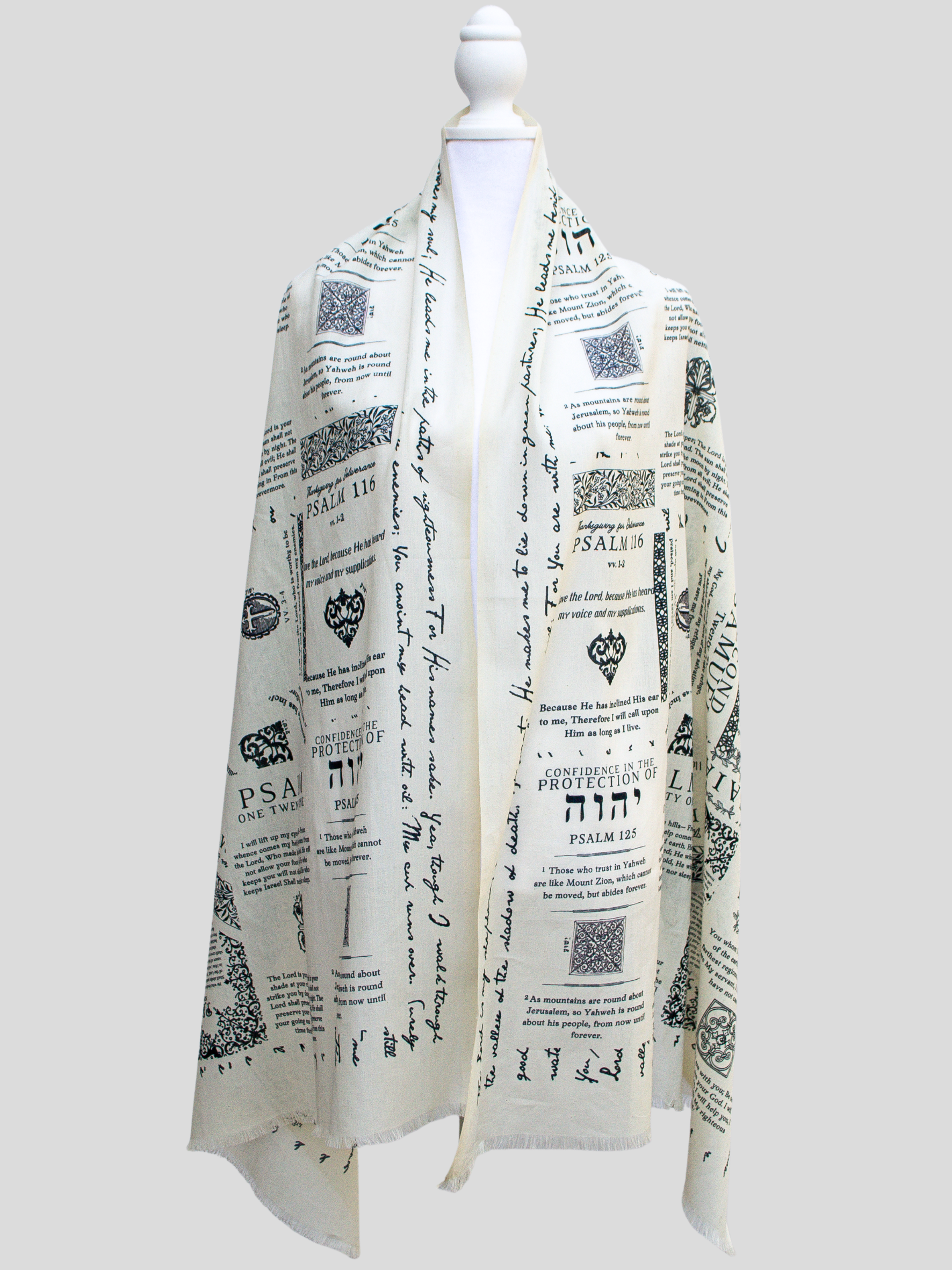 Cotton protection prayer scarf by Prayer Scarves® in ivory, shown on a display form, made from organic cotton and featuring Scripture passages about God’s protection