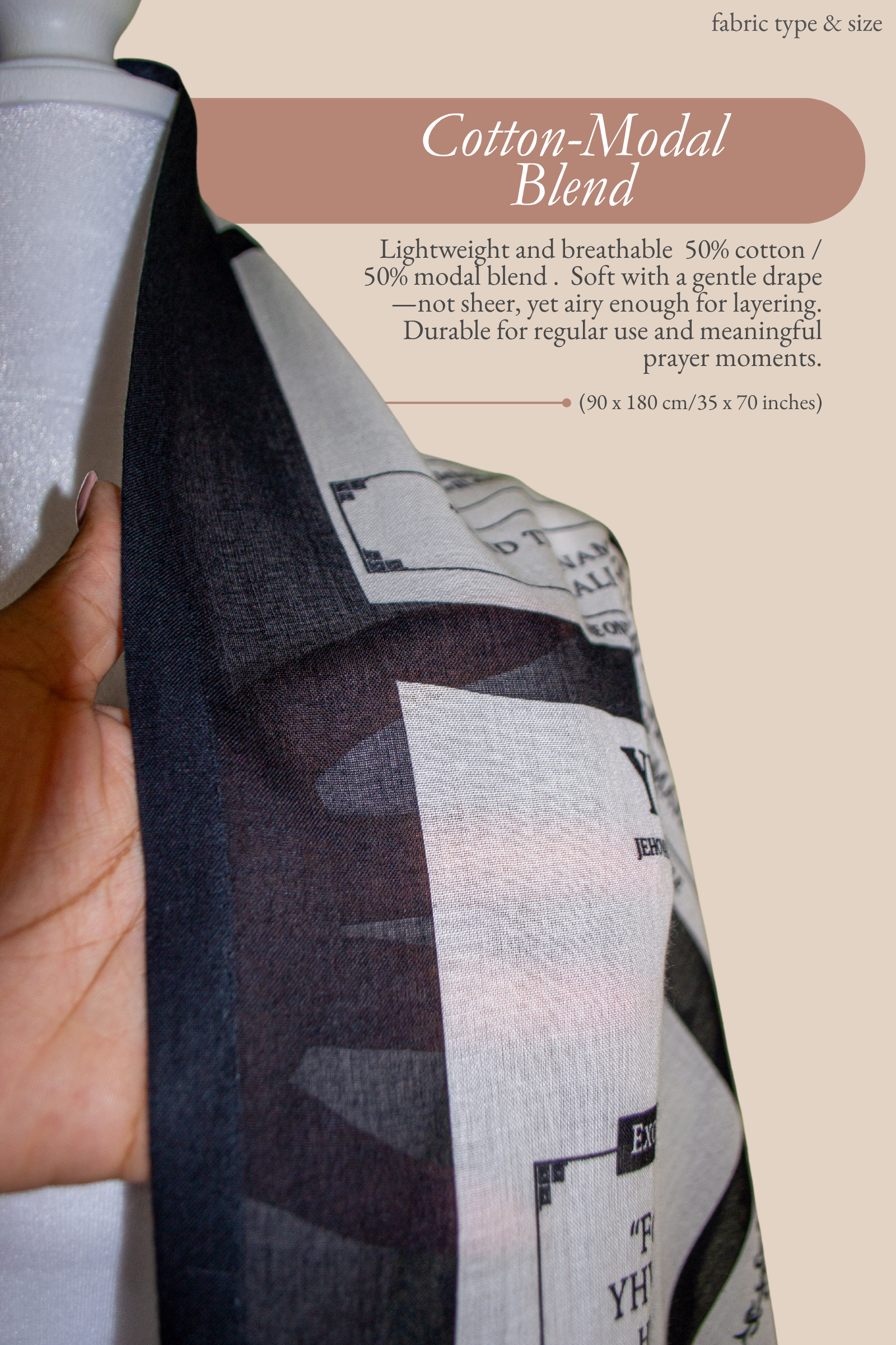 A close-up view of the Names of God protection prayer scarf fabric being held to show its weight and texture. The Prayer Scarves® material is a breathable cotton-modal blend featuring printed blocks with Hebrew names of God and Scripture passages about God’s protection, such as "YHWH Rapha: For I am YHWH your healer."