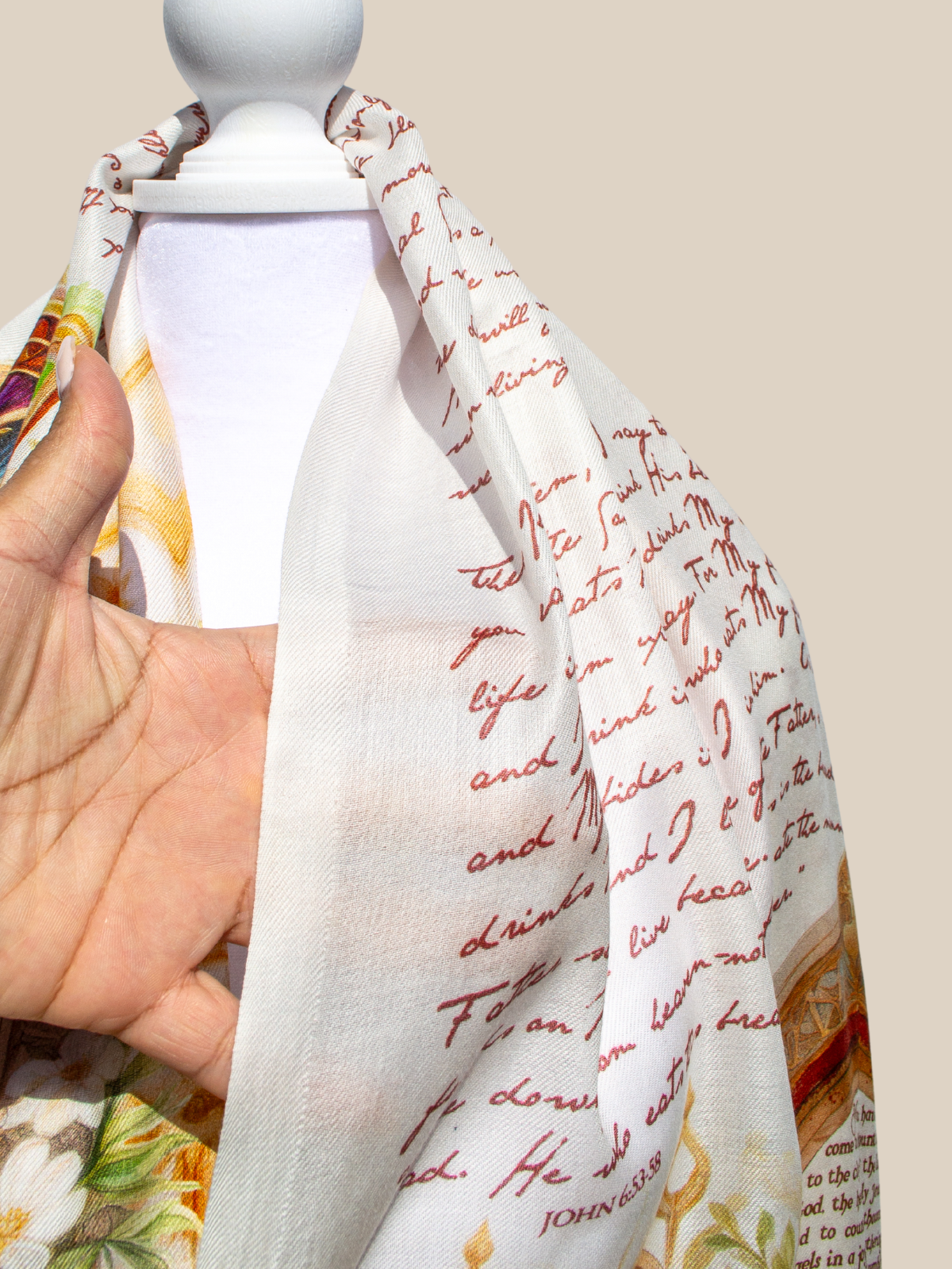 Covenant prayer scarf by Prayer Scarves® shown in close detail on a white mannequin, highlighting handwritten-style scripture text, cream fabric tones, and portions of the ornate architectural design.