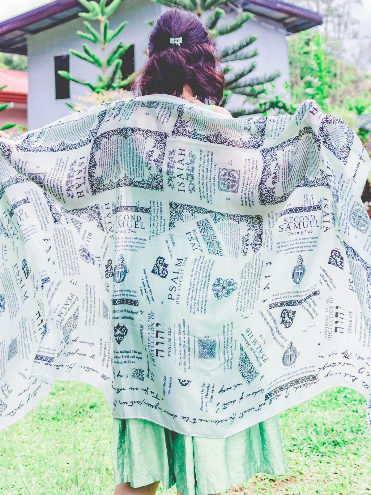 Protection prayer scarf by Prayer Scarves® in honeydew green, worn open across the shoulders, displaying Scripture passages about God’s protection from Psalms, Isaiah, and Second Samuel as a reminder of prayer and trust in God
