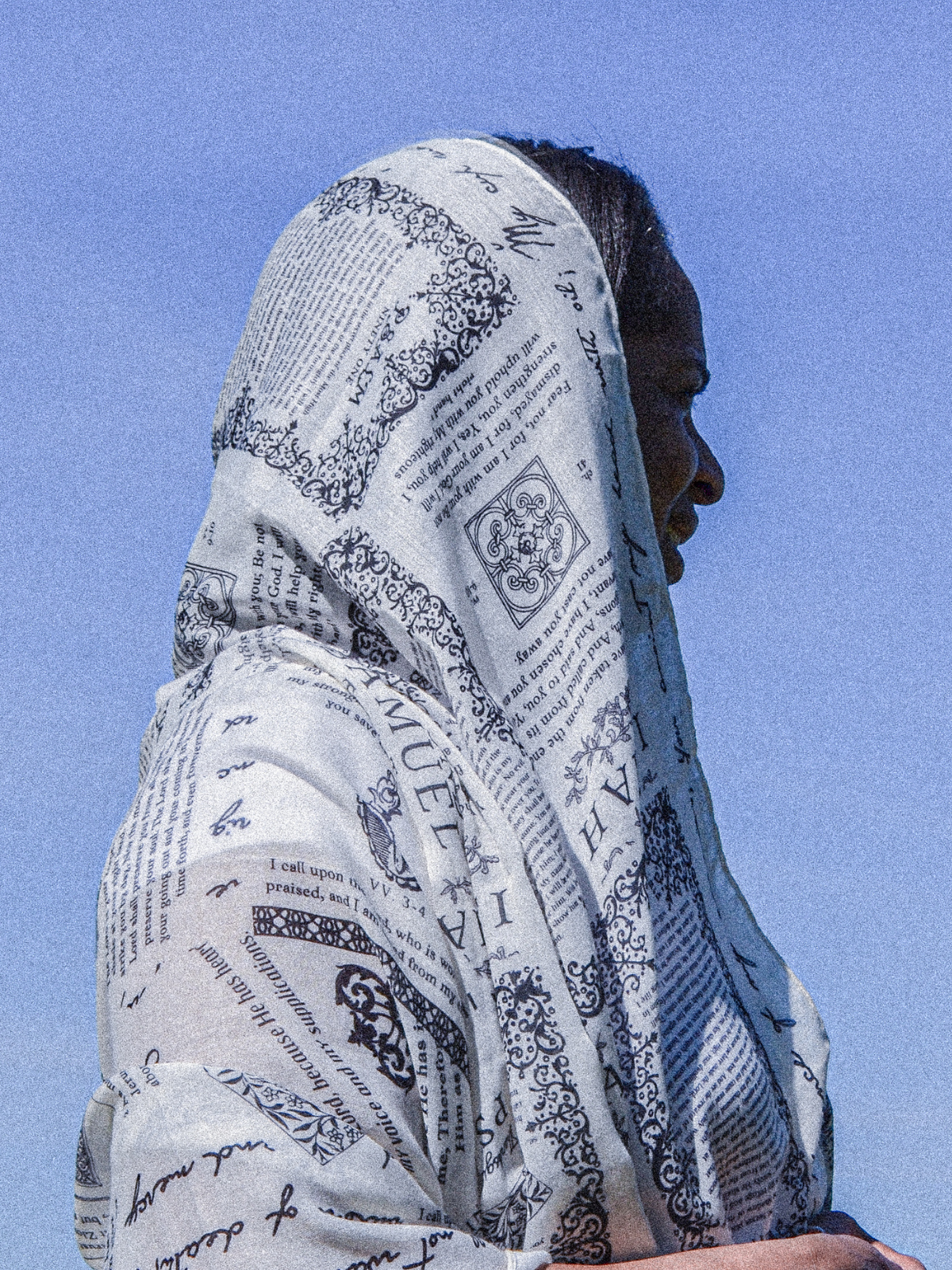 Protection prayer scarf by Prayer Scarves® in ivory, worn as a head covering, featuring Scripture passages about God’s protection from Psalms and Isaiah, shown as a reminder of prayer and trust in God